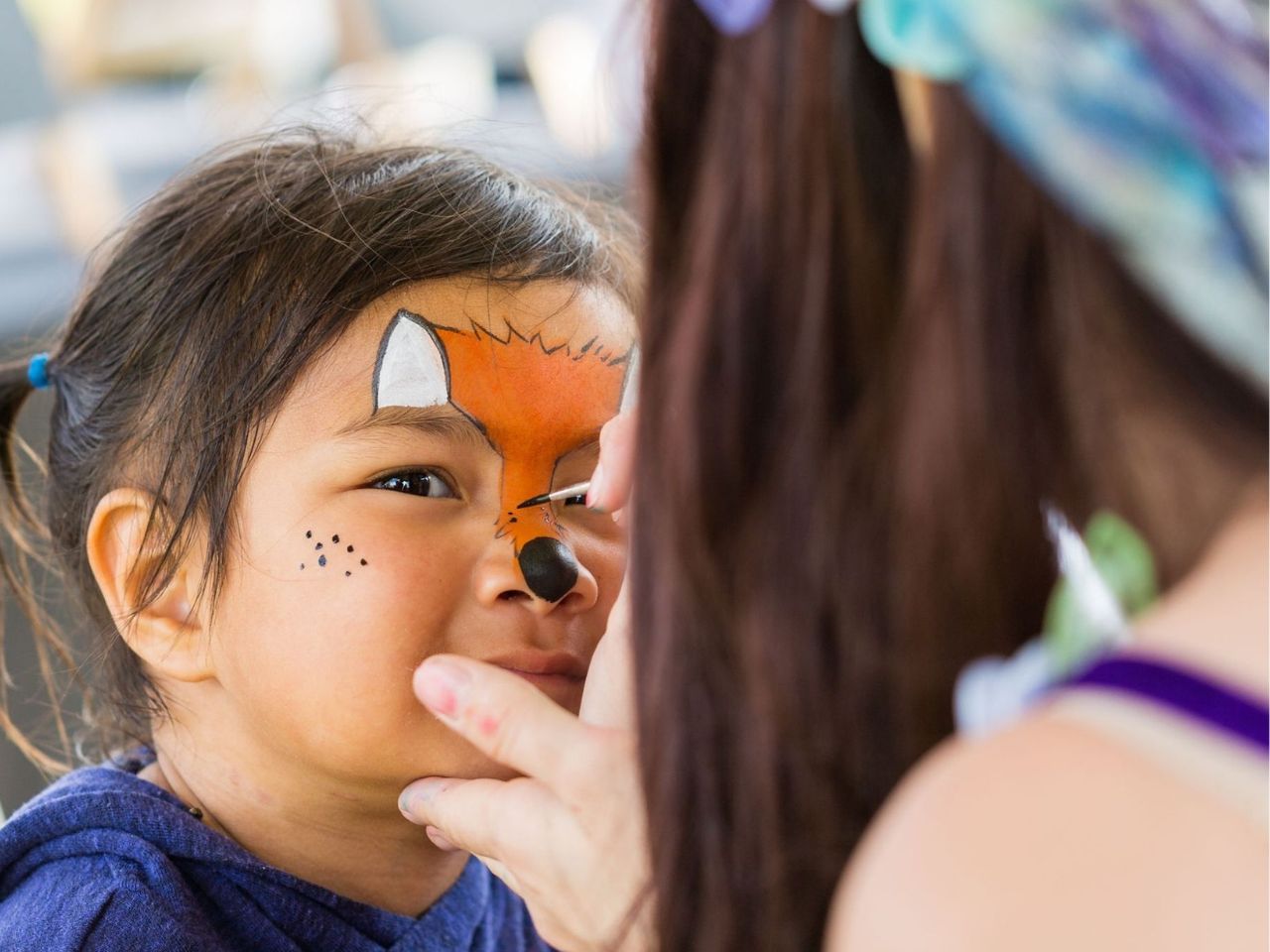 Allara, Eglinton community events, child getting their face painted.