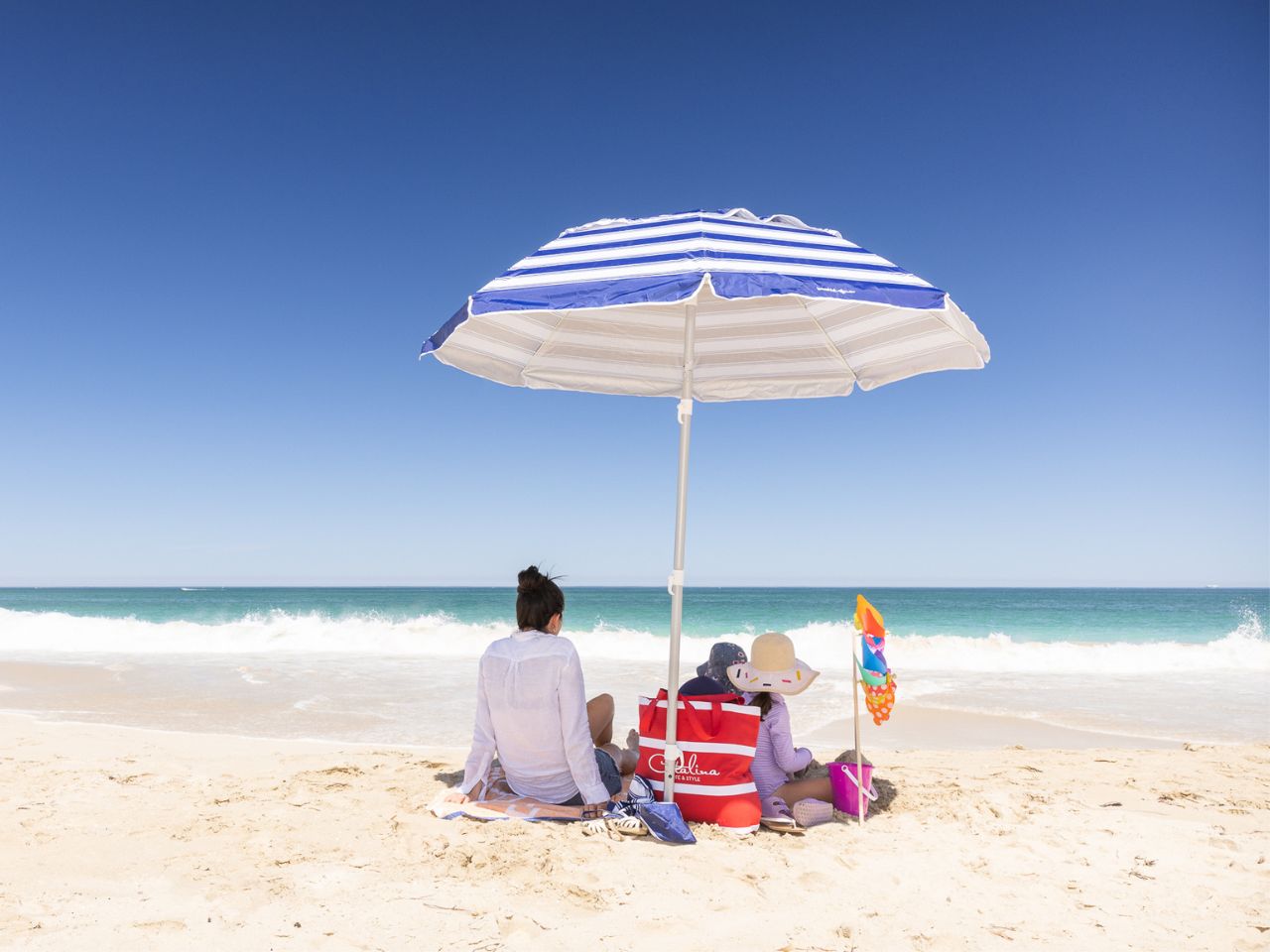 Catalina, Mindarie and Clarkson, mother and children sitting on the beach