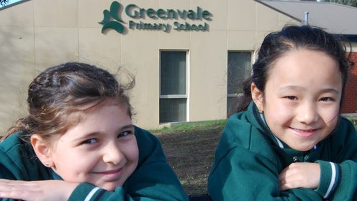 True North, Greenvale primary with two students sitting at the front of the school.